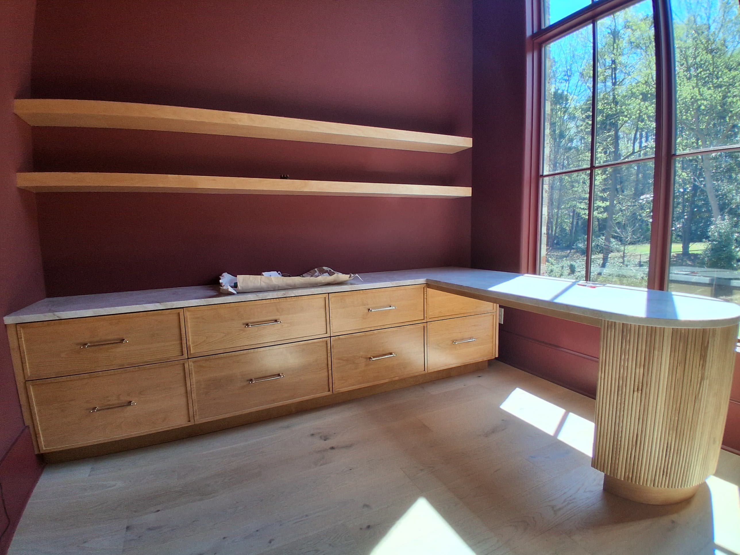 Burgundy fluted built-in desk cabinetry made by Hdez Gabinets, a custom cabinet maker in Atlanta